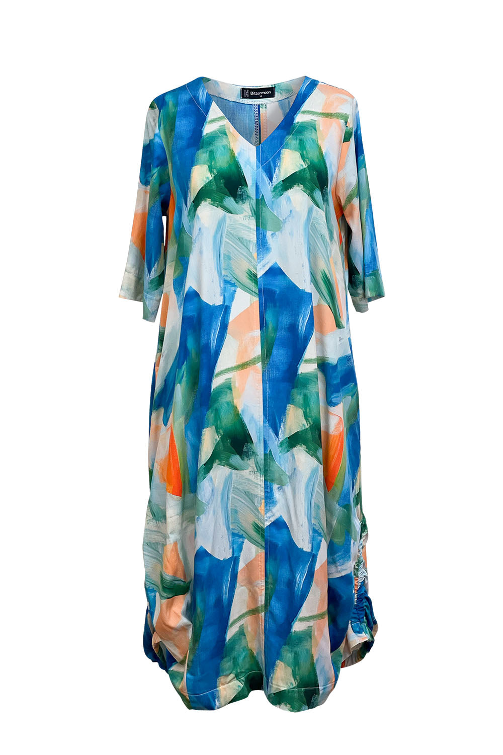 Bittermoon Viva Dress in Lagoon – abstract print midi in blue, green, and peach. Cocoon shape with side ruching and ¾ sleeves. Made in New Zealand.